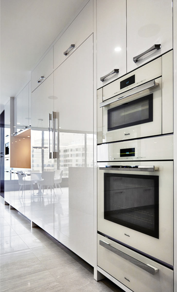 White kitchen for a 3250 square feet condo in Toronto